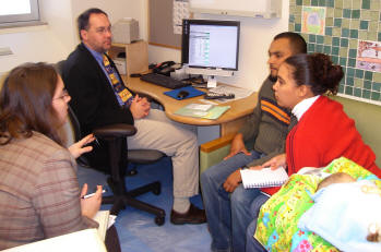 Dr. Tom Boyce meets with Illich's parents