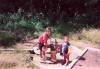 children check the new water pipes