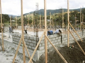 Laying the concrete block into place