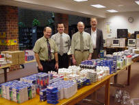 Al Vonnahme, Mark Frentress, Tom Ryan, & Richard Seivert behind medicines purchased from Hy-Vee