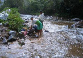 women doing wash in the river