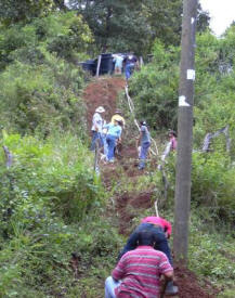 Briar Cliff University Team works up the hill to the water tank