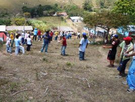 workers pass bricks up the mountainside